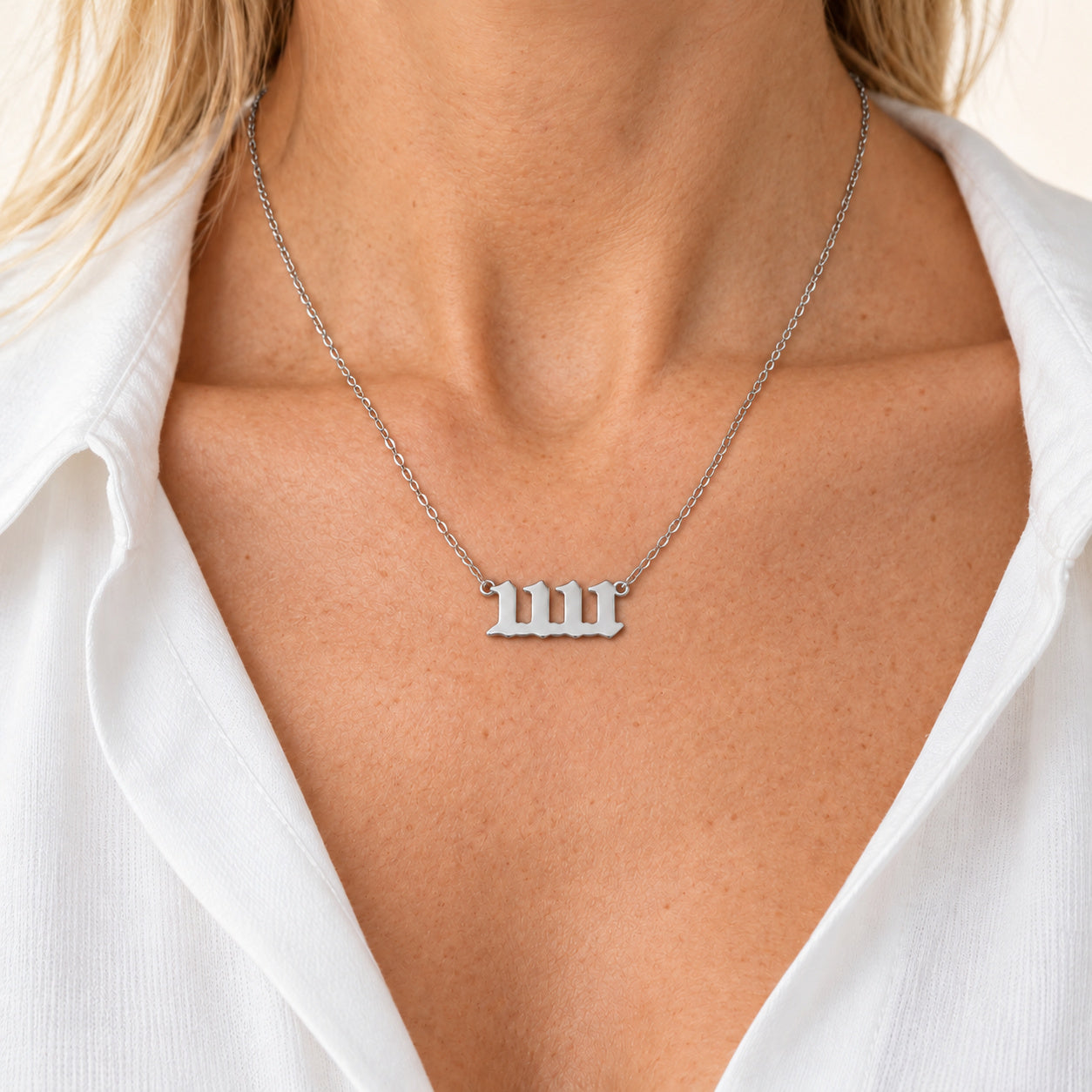 11:11 necklace in silver, worn on a model