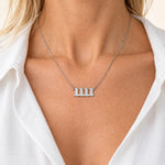 11:11 necklace in silver, worn on a model