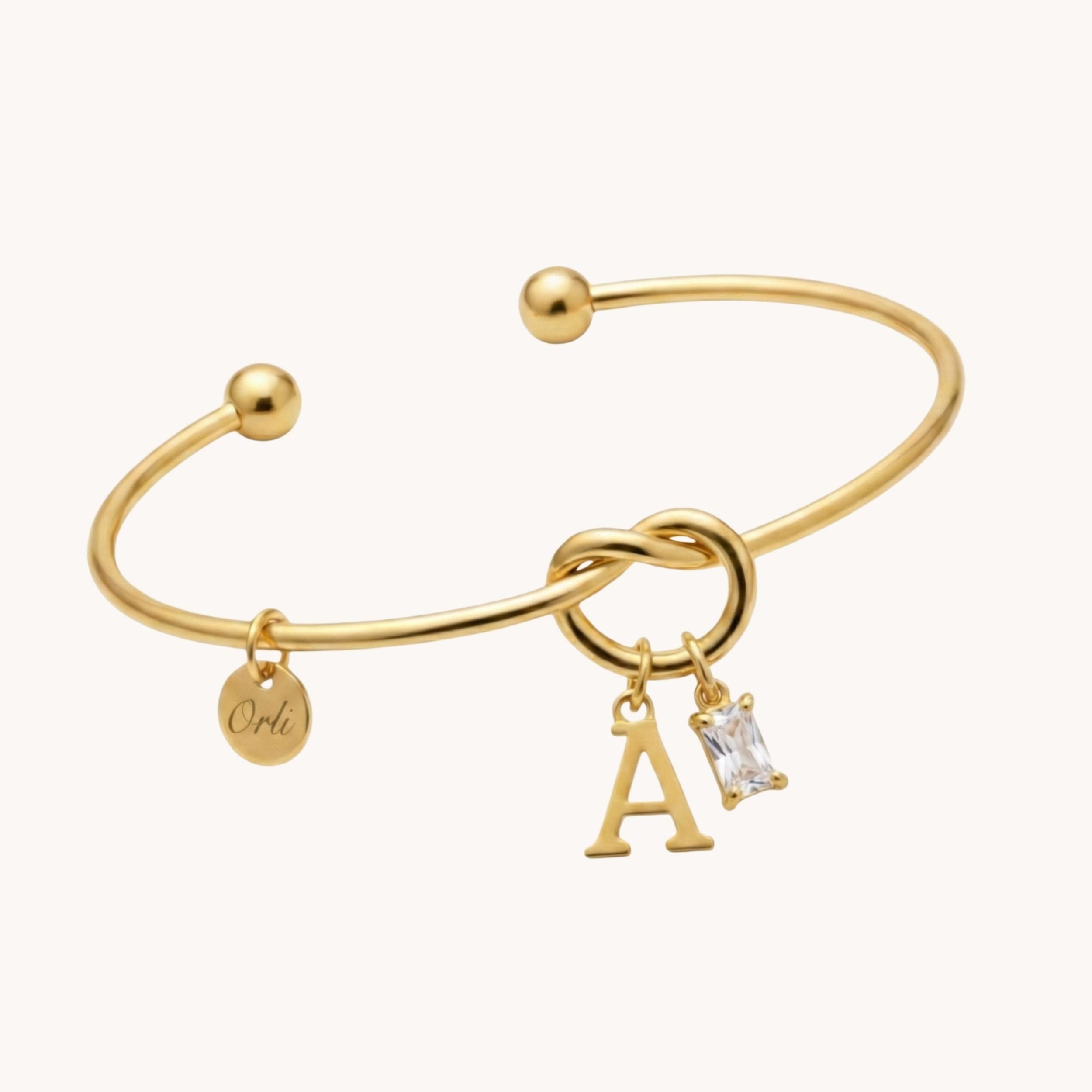 Initial & Birthstone Knotted Bangle in Gold