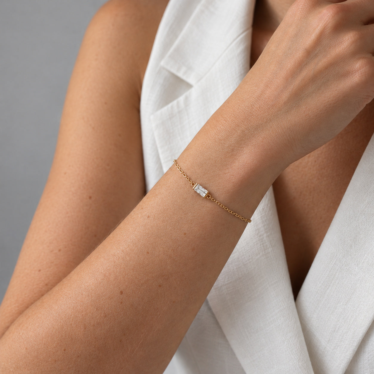 April Ava Fine Birthstone Bracelet in Gold worn on a wrist