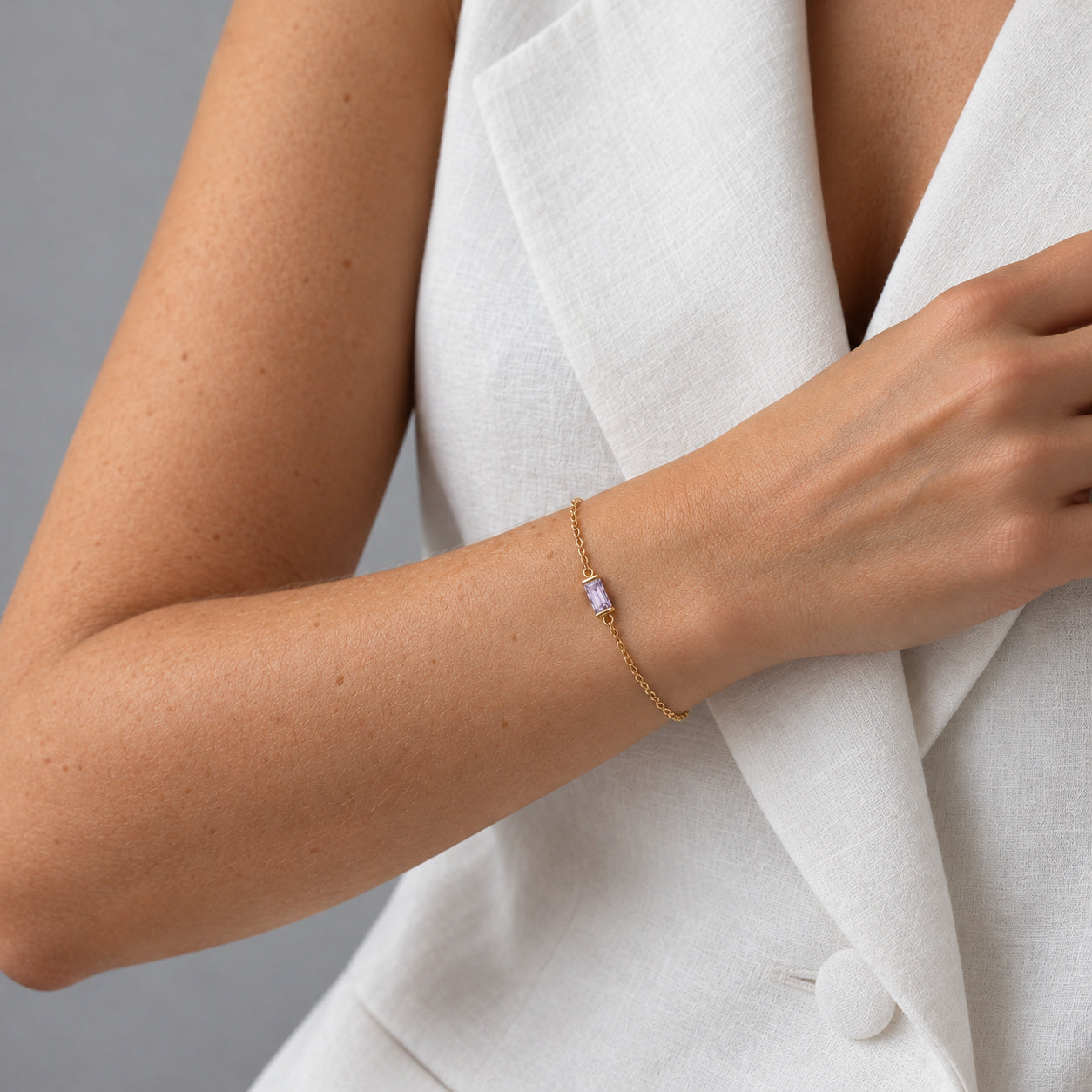 June Ava Fine Birthstone Bracelet in Gold worn on a wrist