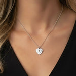 Silver double heart necklace with keyhole detail in stainless steel – waterproof & tarnish-free.