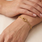 Forever Knot Bracelet in Gold - worn shot