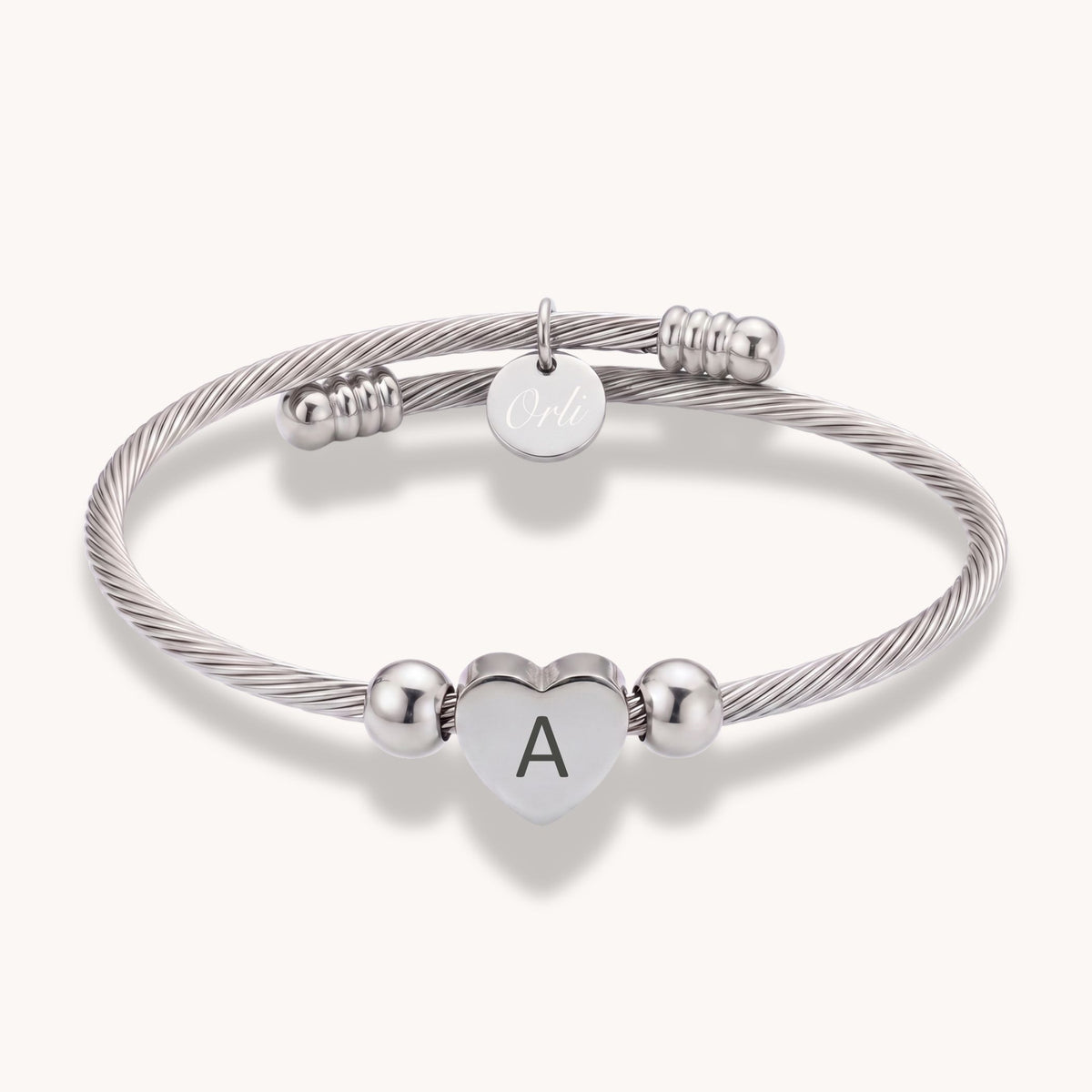 Initial Heart Twist Bangle in Silver