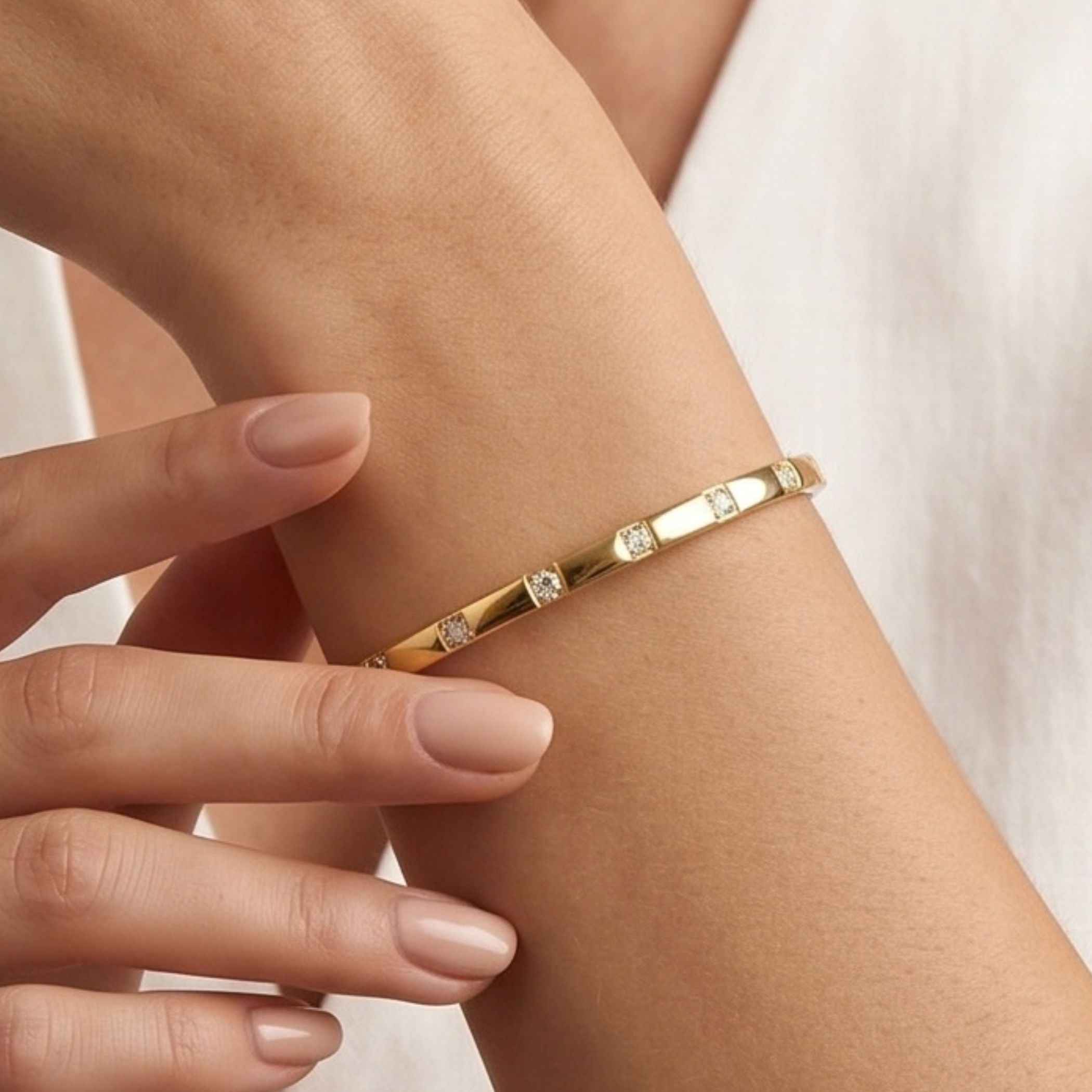Kirstie Square Crystal Bangle in Gold worn on wrist