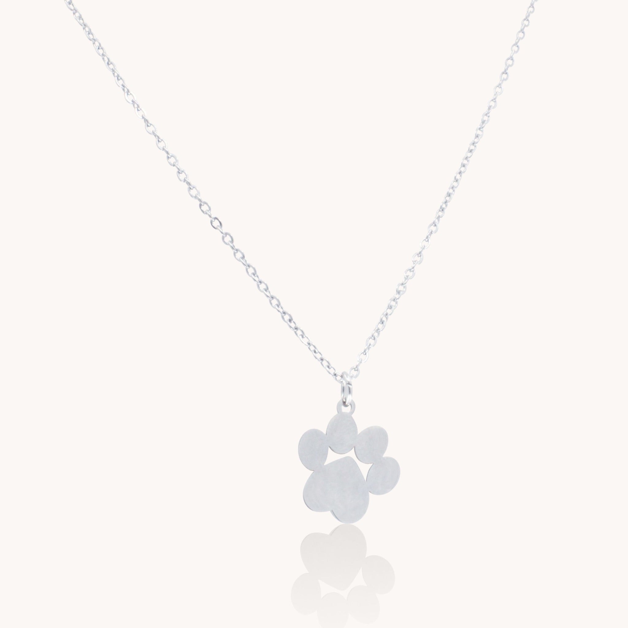 Silver paw print necklace in stainless steel – waterproof & tarnish-free.